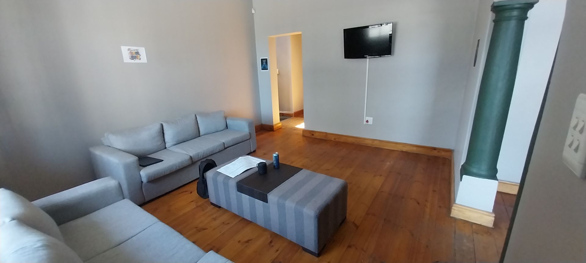 The Karoo lounge with sofas and a TV