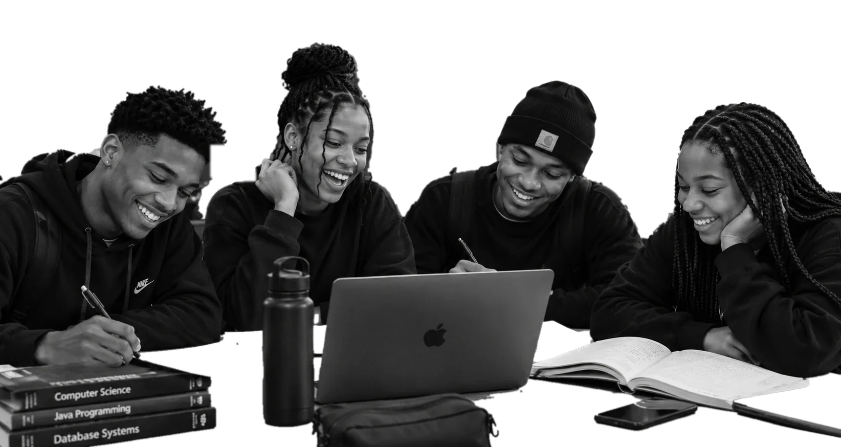 Four students laughing together while studying at a table